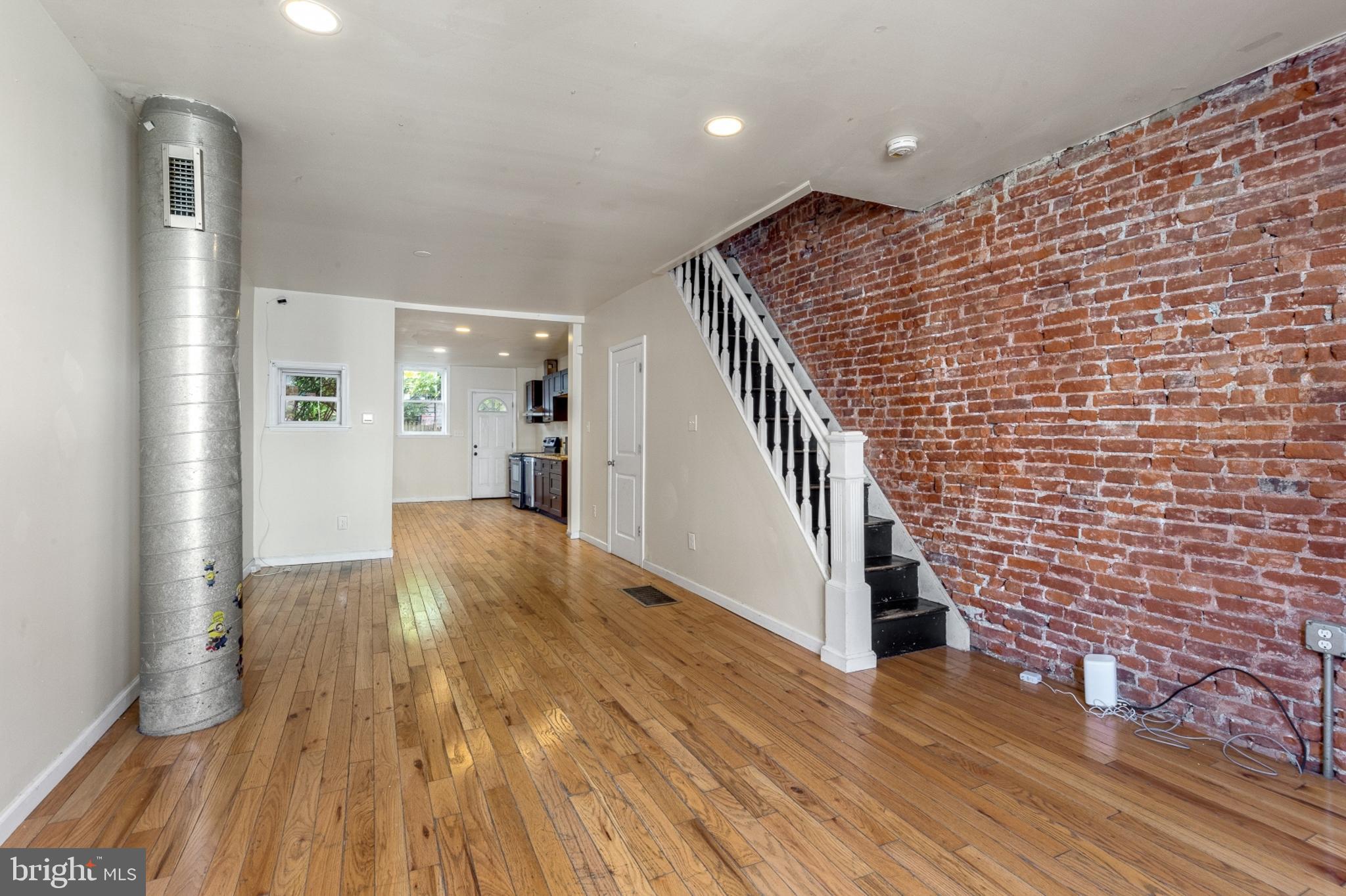 a view of livingroom with hardwood floor and staircase