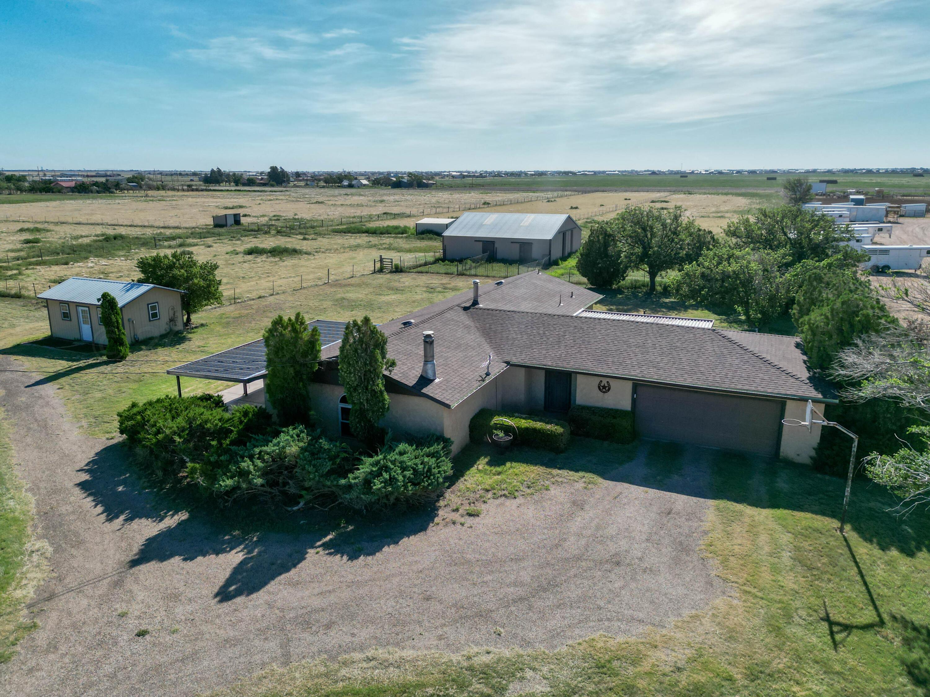 an aerial view of a house with a lake view