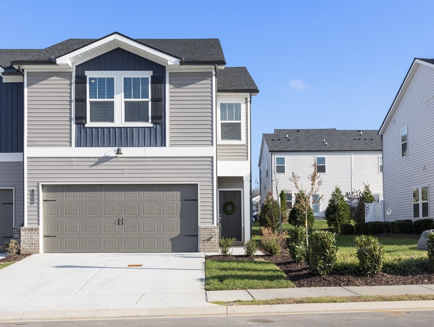 a front view of a house with a yard