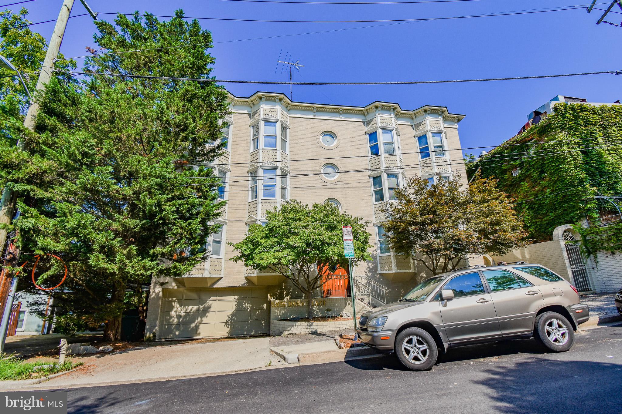 a car parked in front of a house