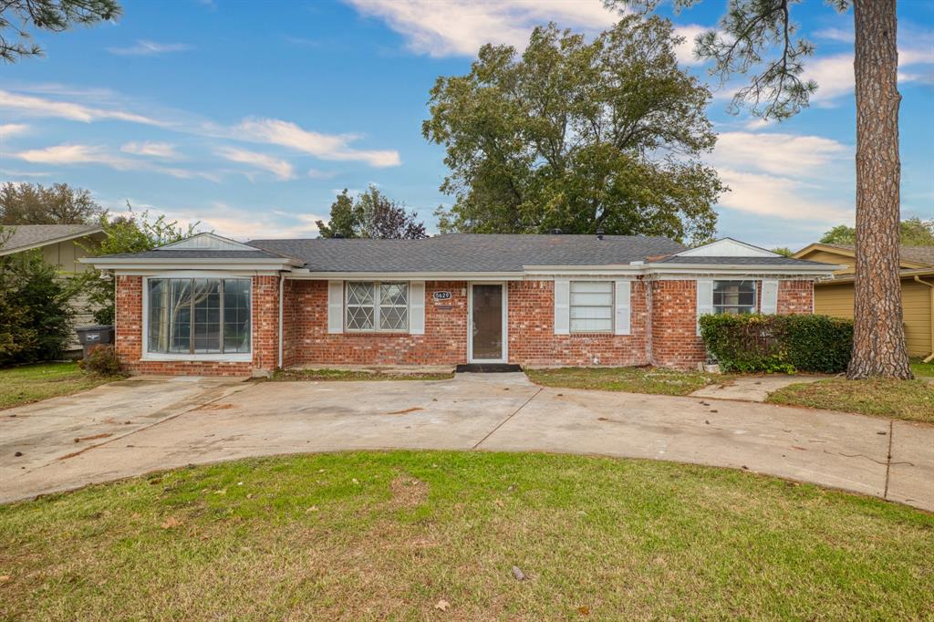 front view of a house with a patio