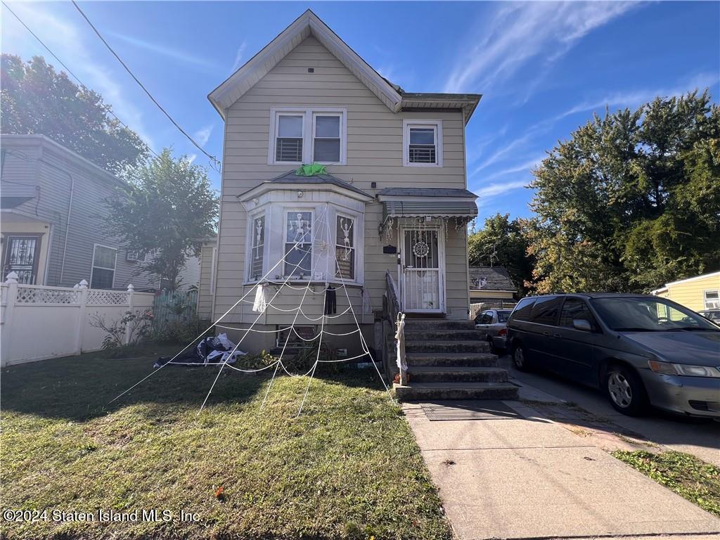 a front view of a house with a yard