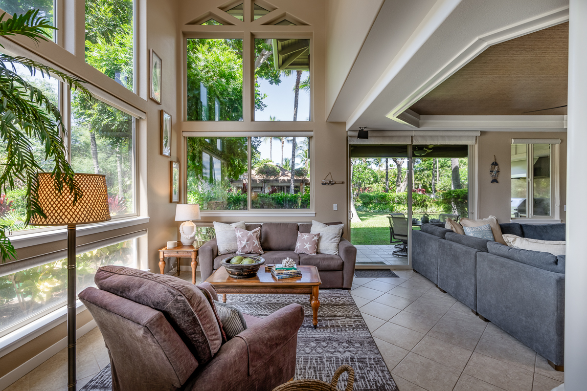 a living room with furniture and windows