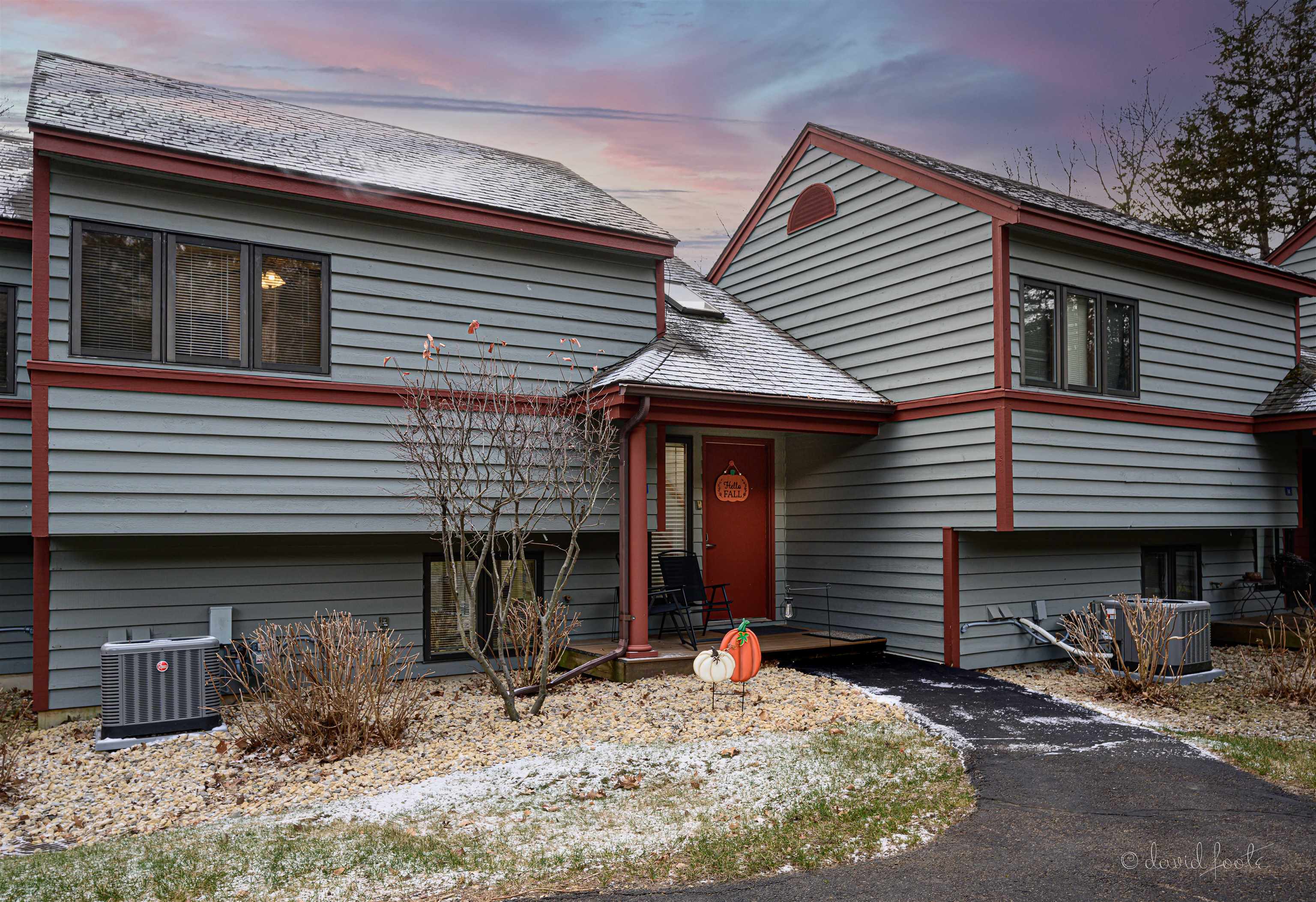 a front view of a house with garage