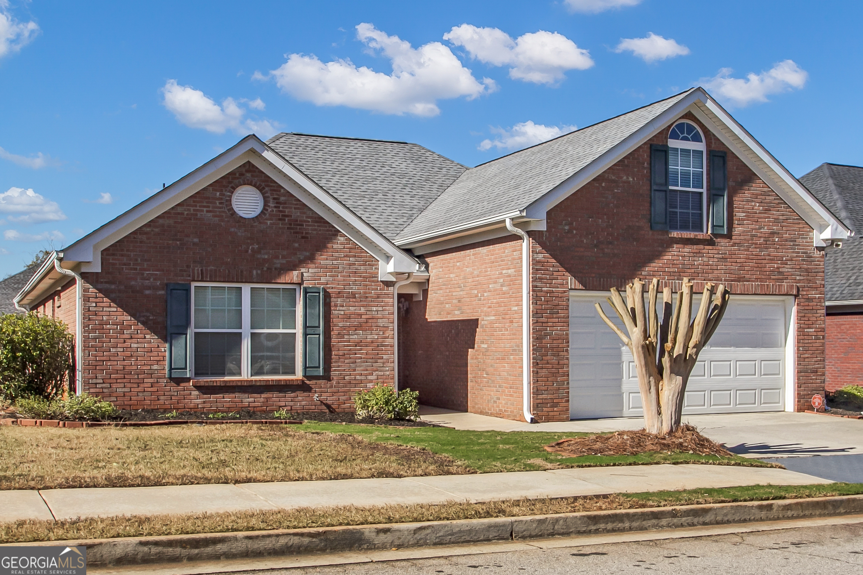 a front view of a house with a yard