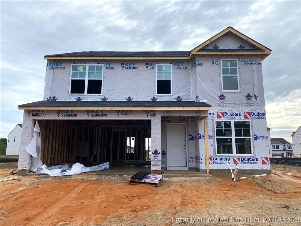 a front view of a house with a garage