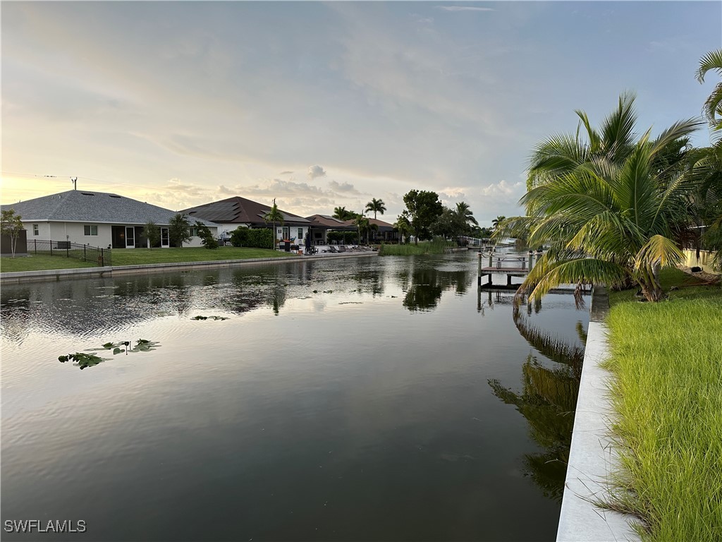 a view of a lake with houses in background