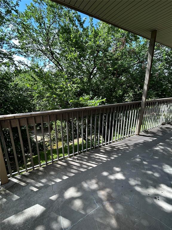 a view of street with deck and backyard