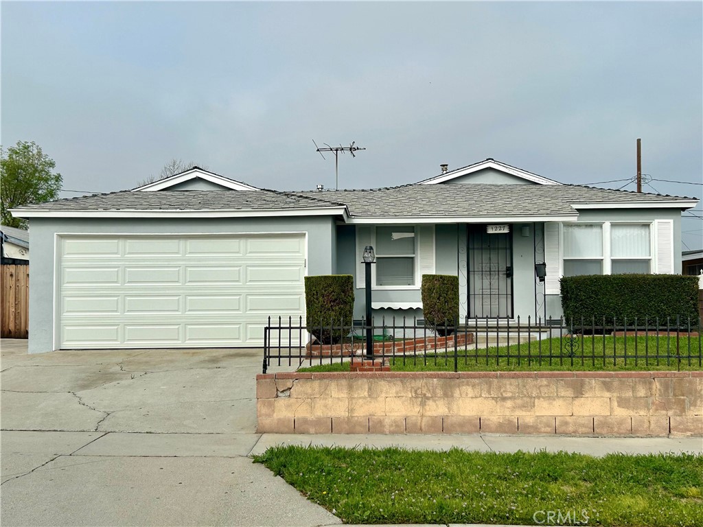 a front view of a house with garage