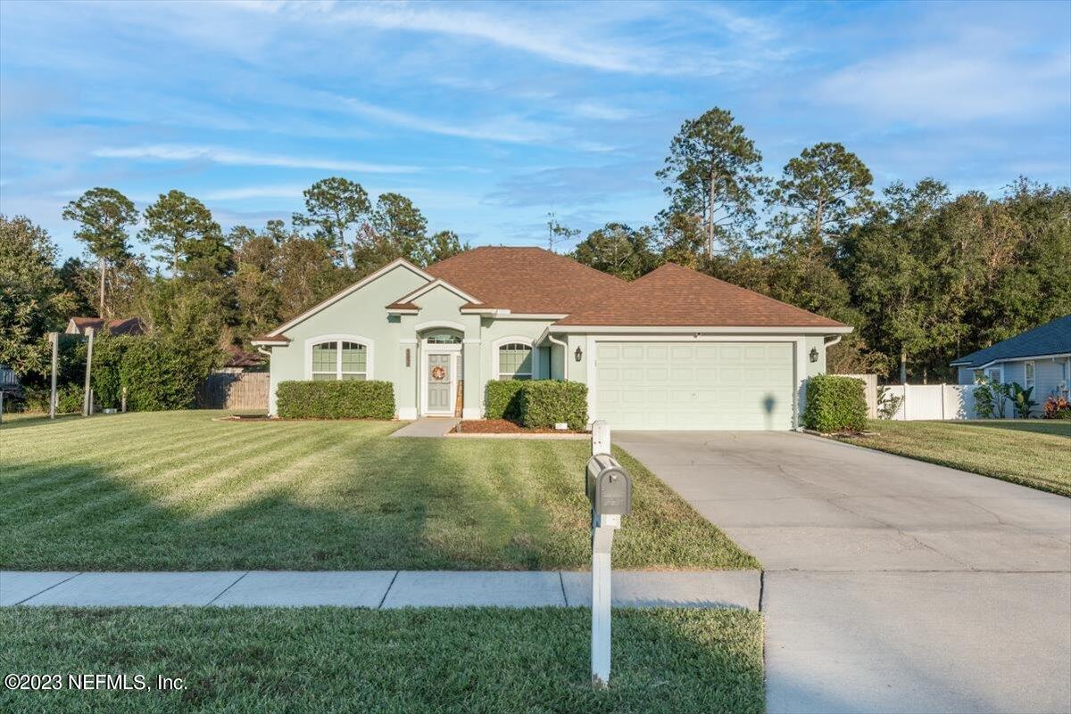 a front view of a house with a yard