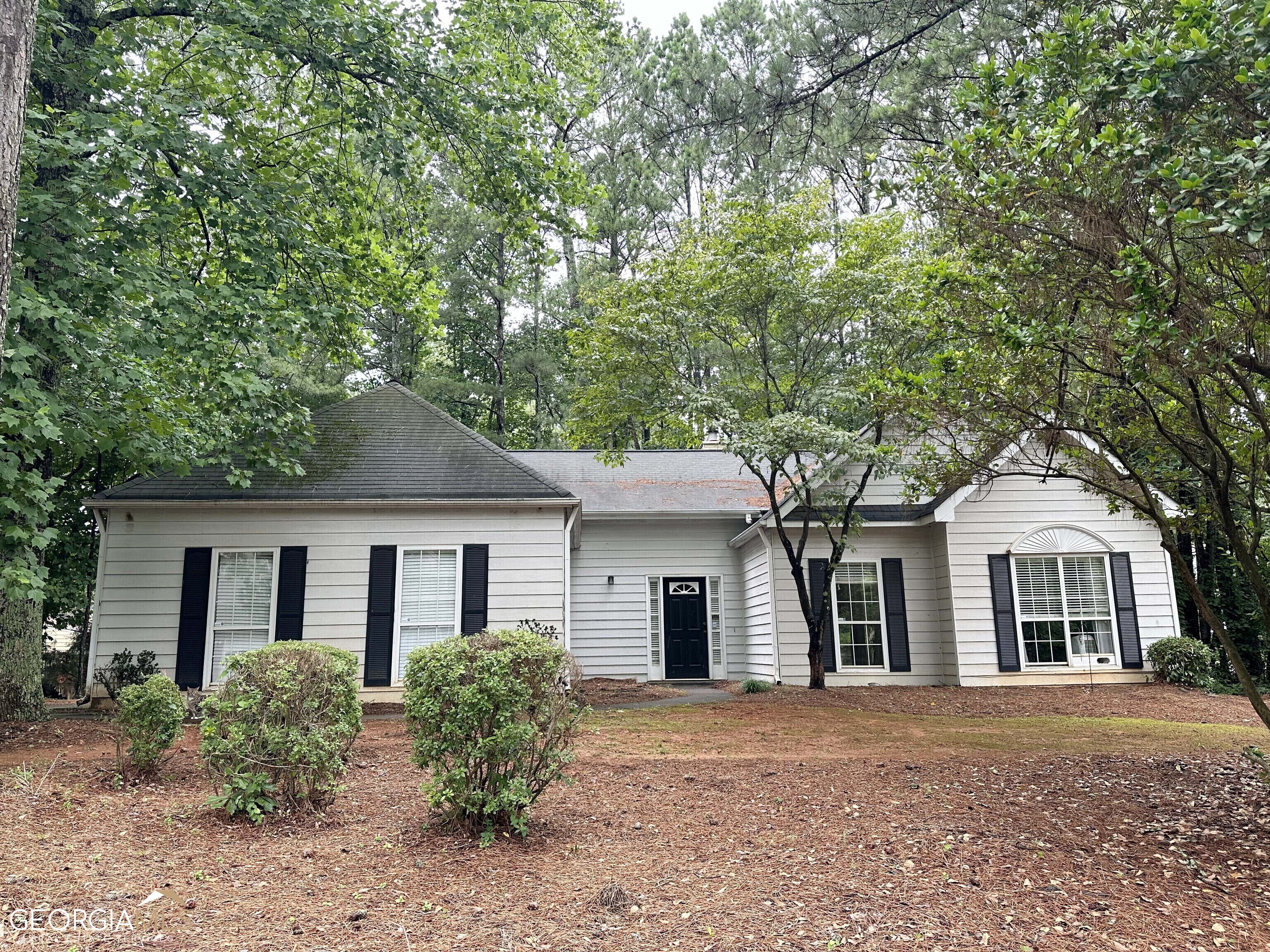 front view of a house with a garden