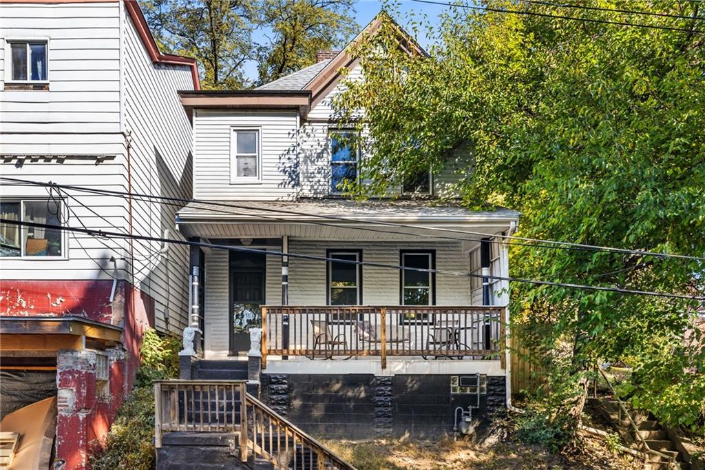 a house that has tree in front of it