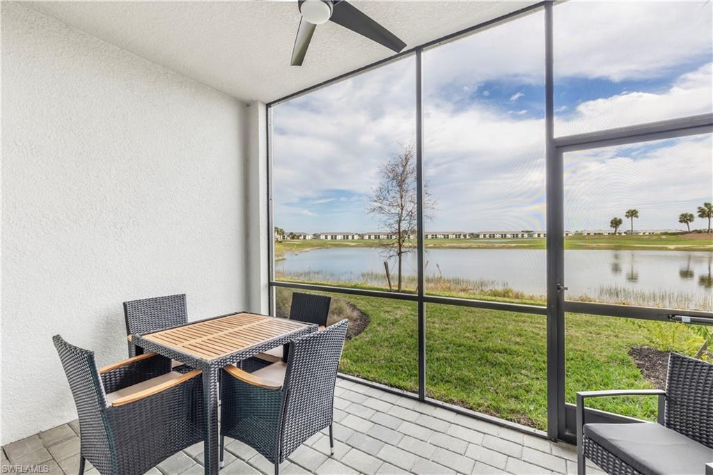 a view of a city from a dining room with floor to ceiling window