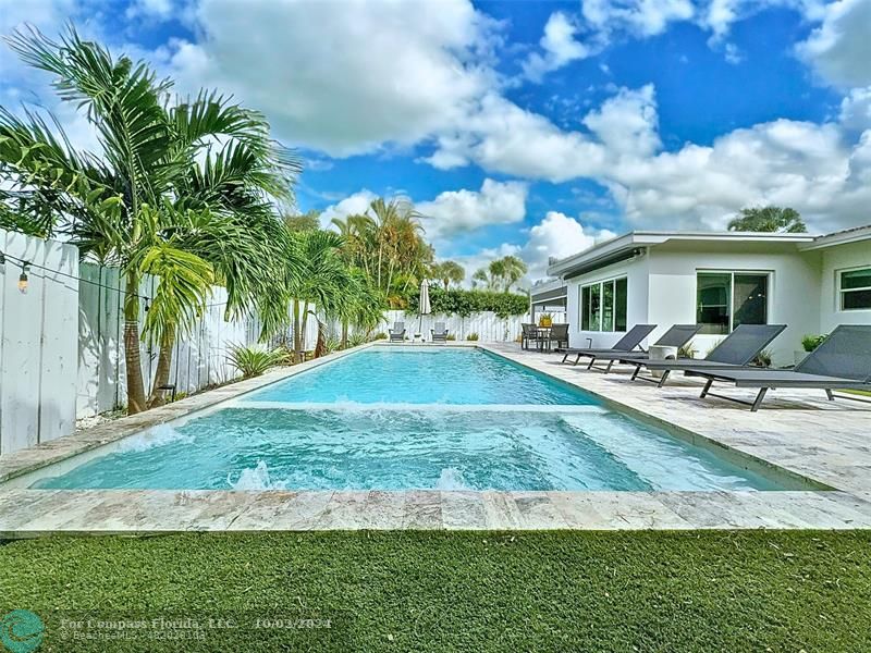 a view of a yard with a patio