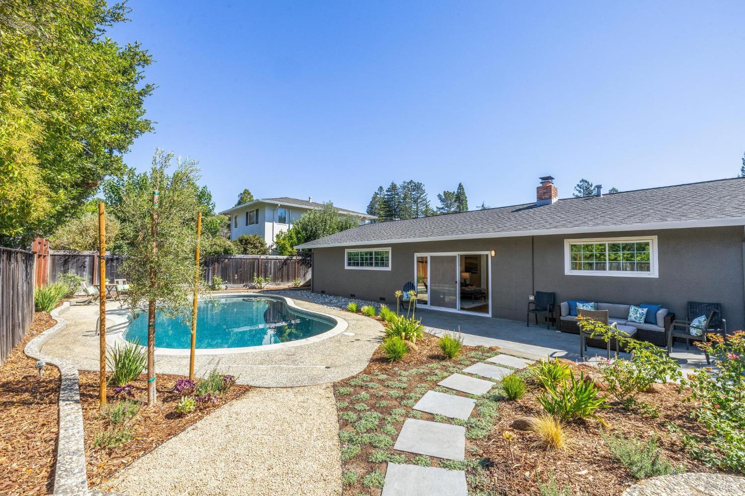 a view of a house with a backyard