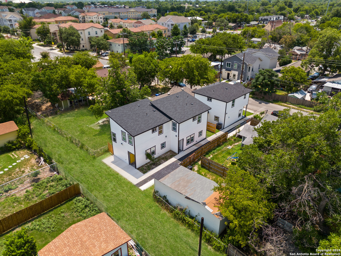 an aerial view of a house with a garden