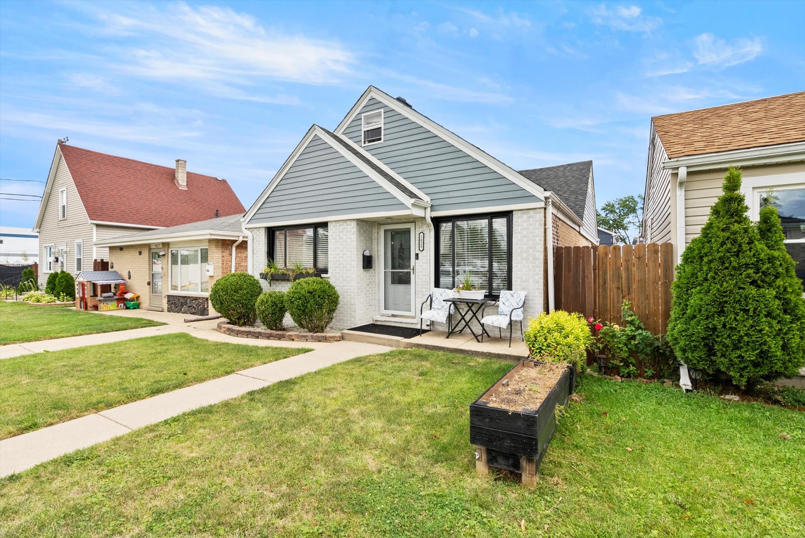 a view of a house with a yard patio and slide