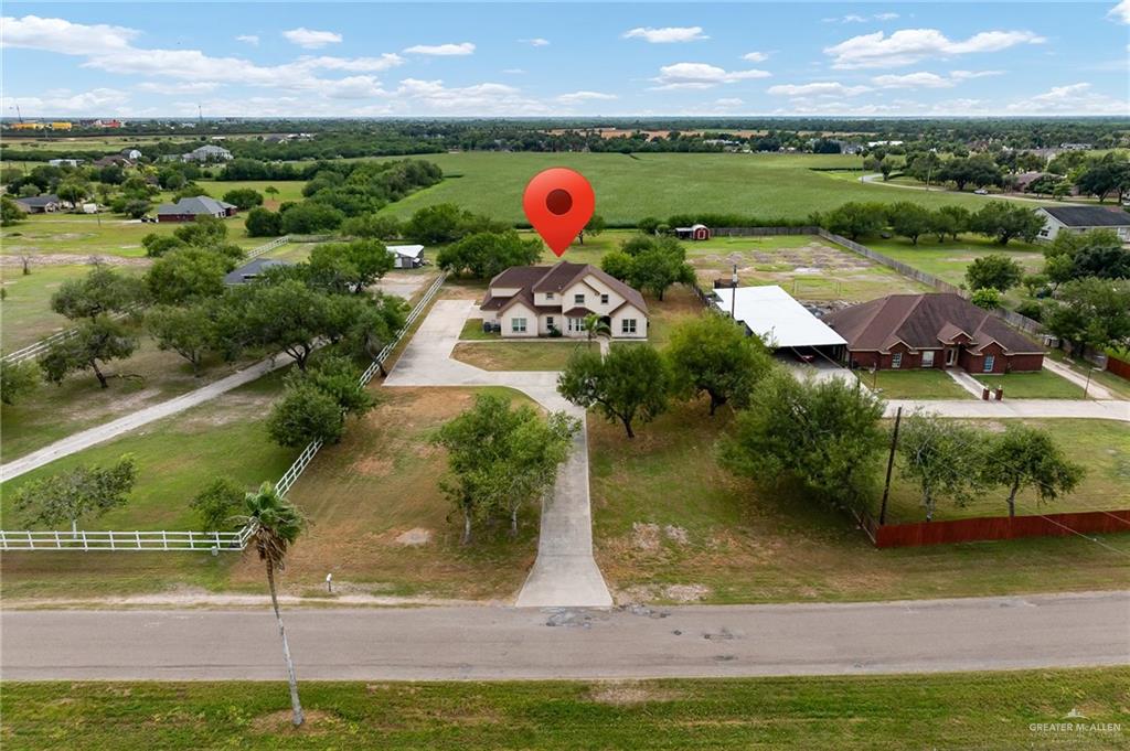 an aerial view of a house with outdoor space