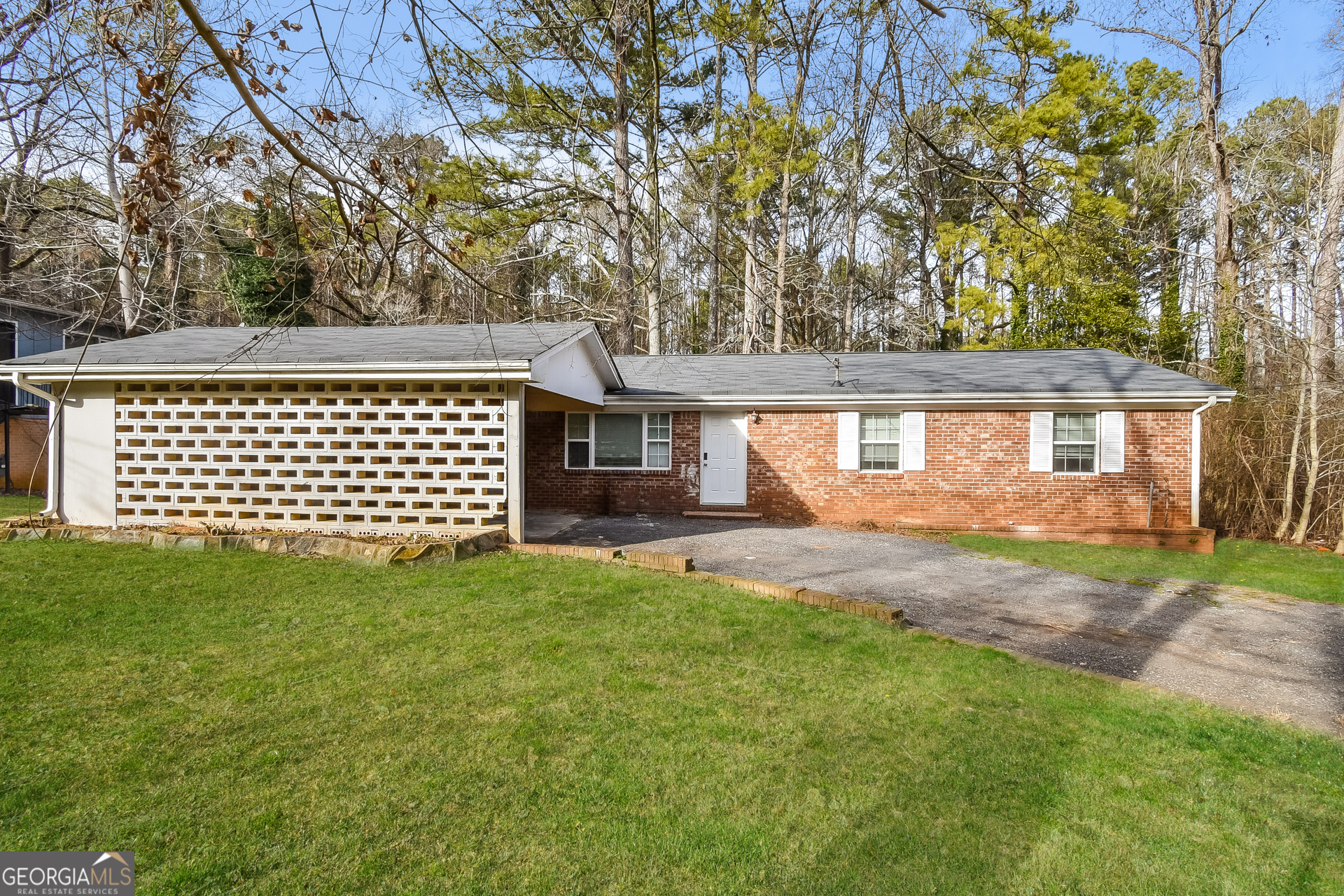 front view of a house with a yard