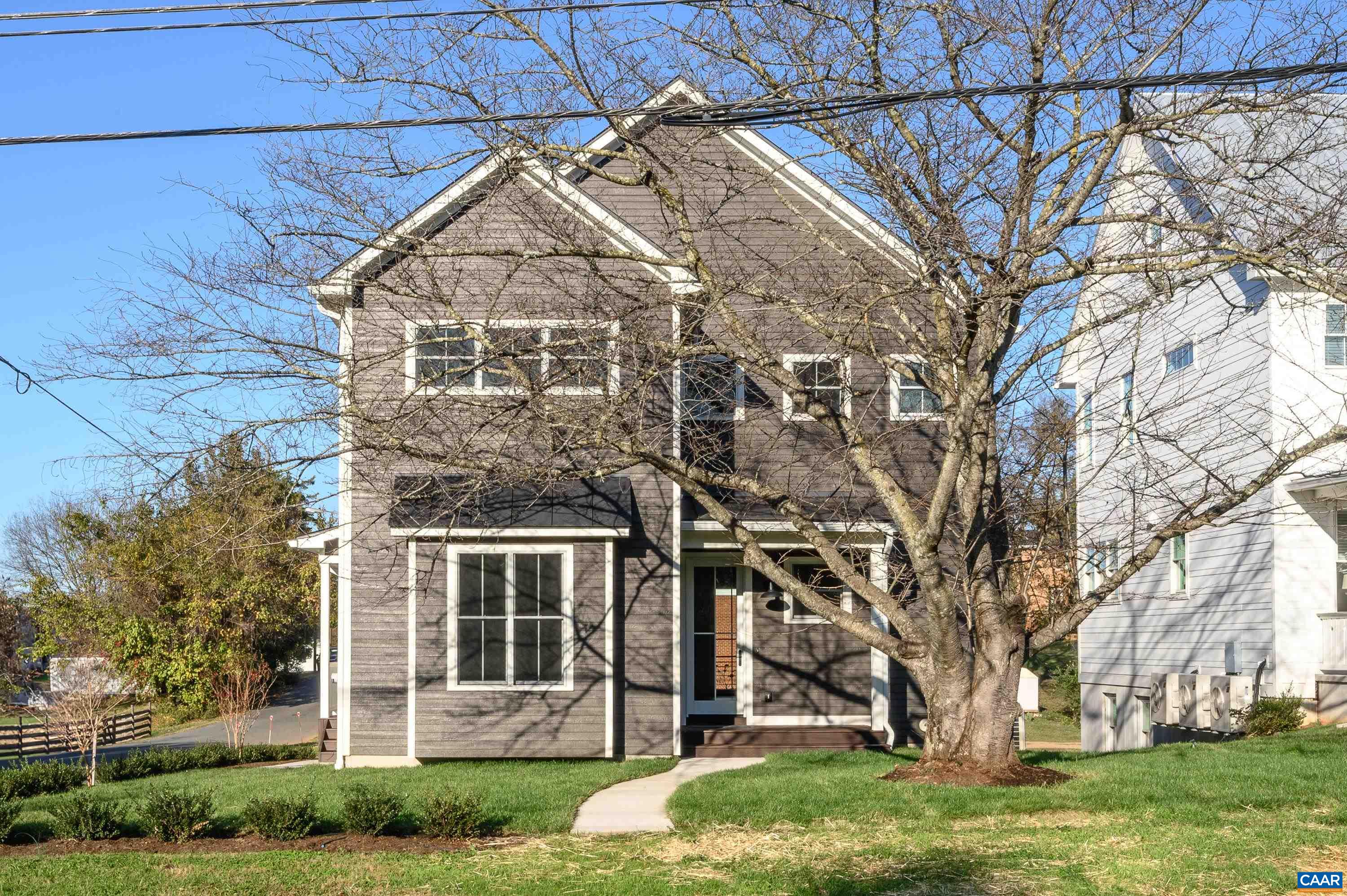 front view of a house with a yard