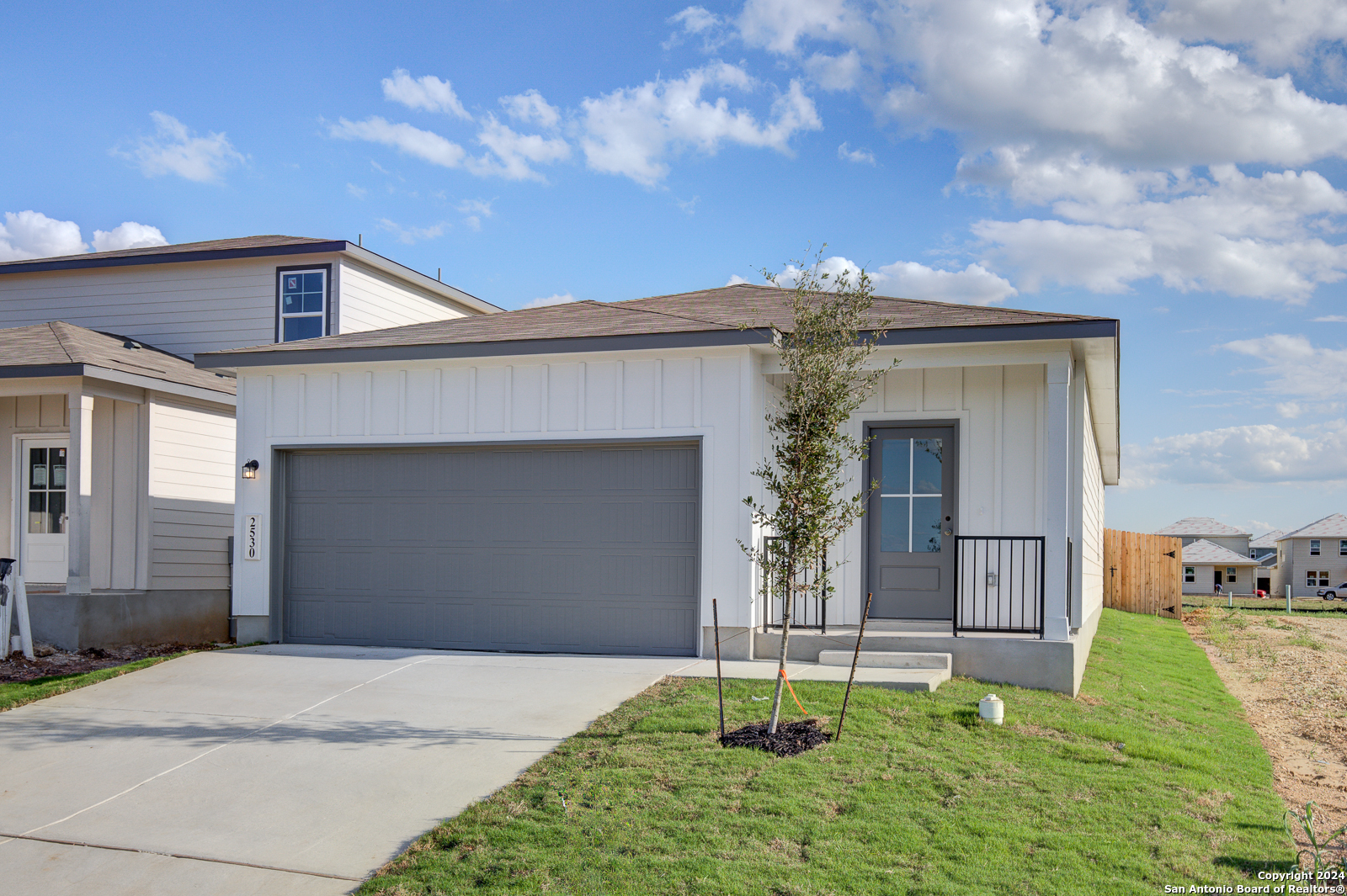 a front view of a house with a yard