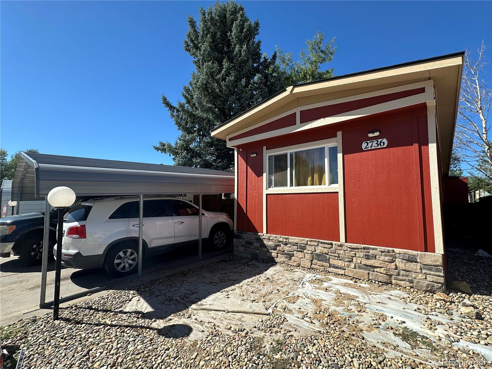 a front view of a house with parking