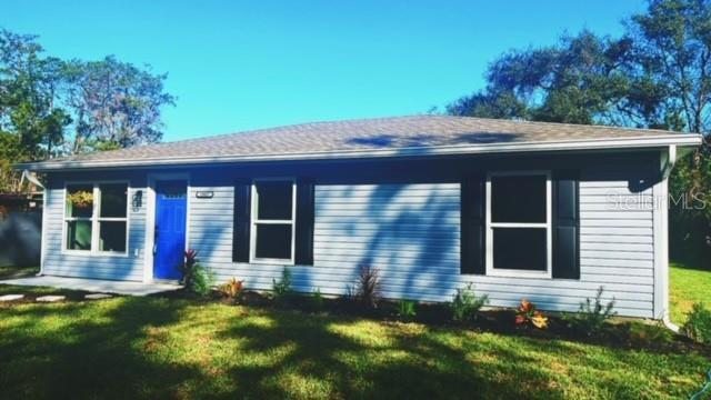 front view of a house with a yard