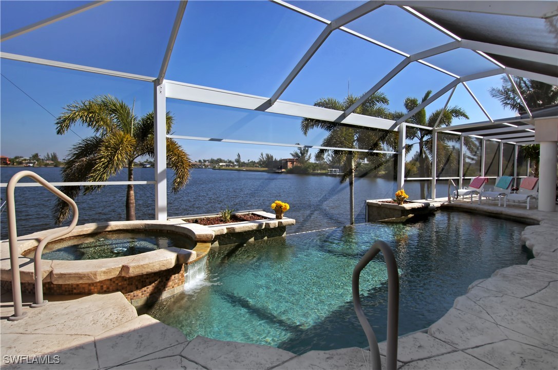 a view of swimming pool with outdoor seating