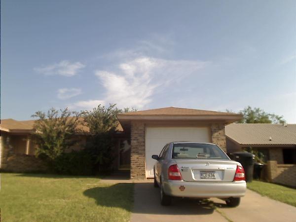 a car parked in front of a house