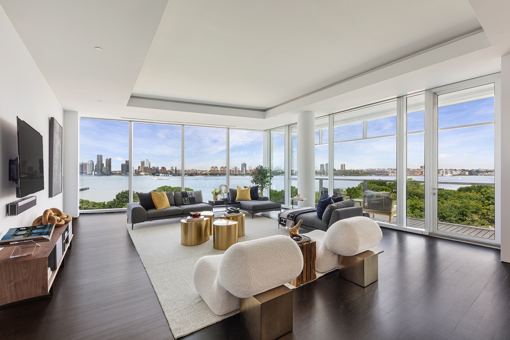 a very nice looking living room with a large window and a flat screen tv