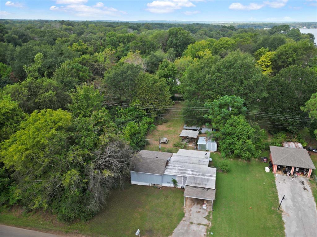 an aerial view of a house with a yard