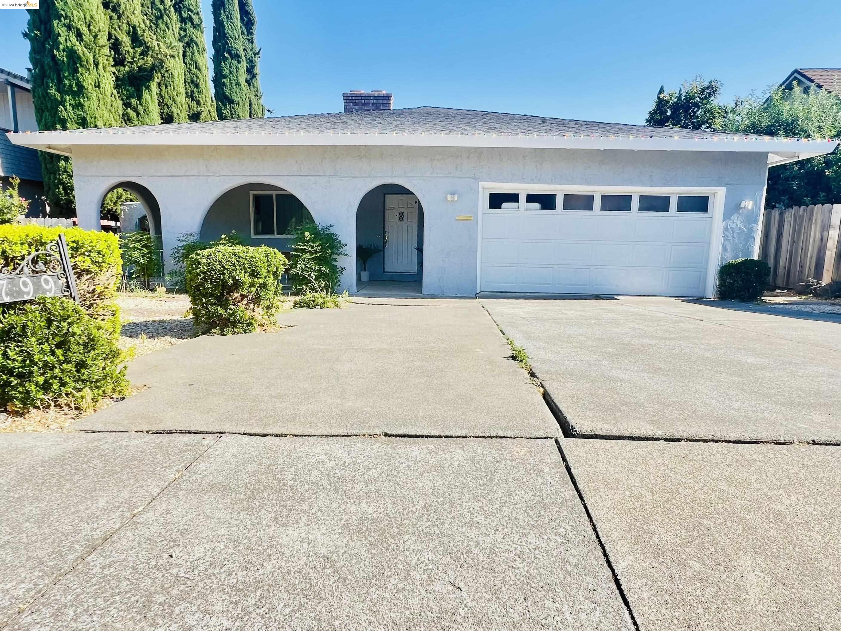 a front view of a house with garage