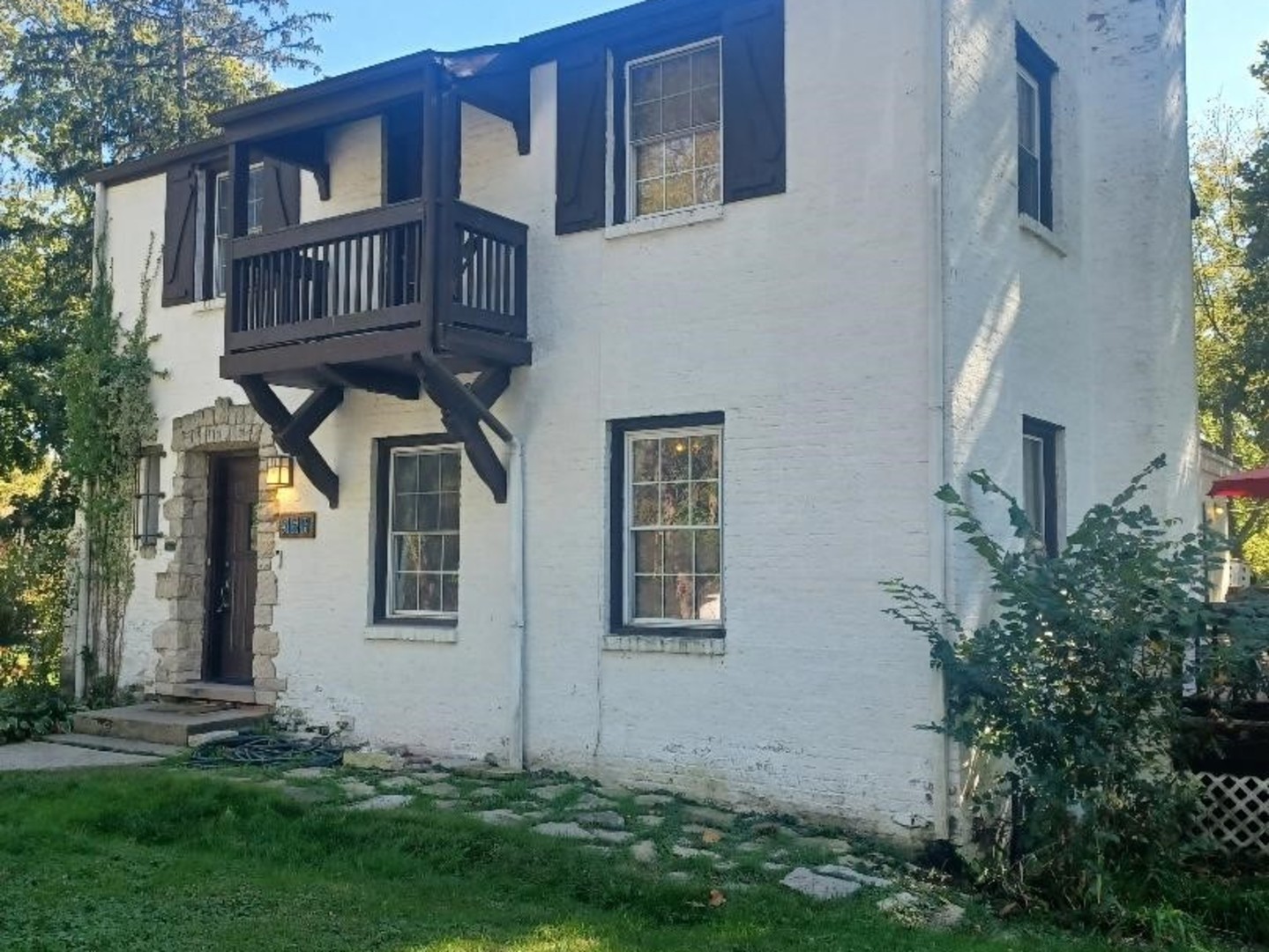 front view of a house with a yard