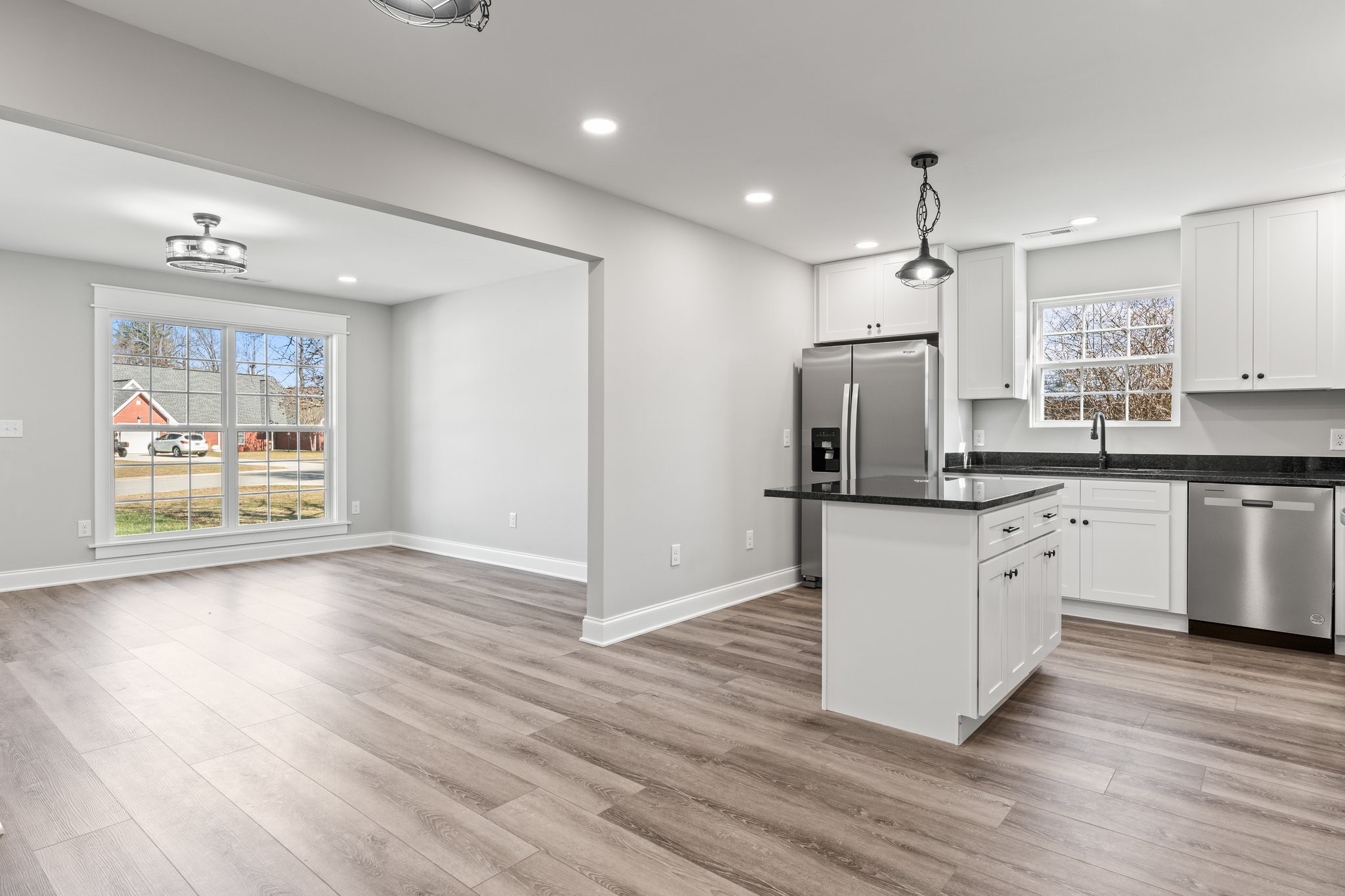 a kitchen with a refrigerator and a sink