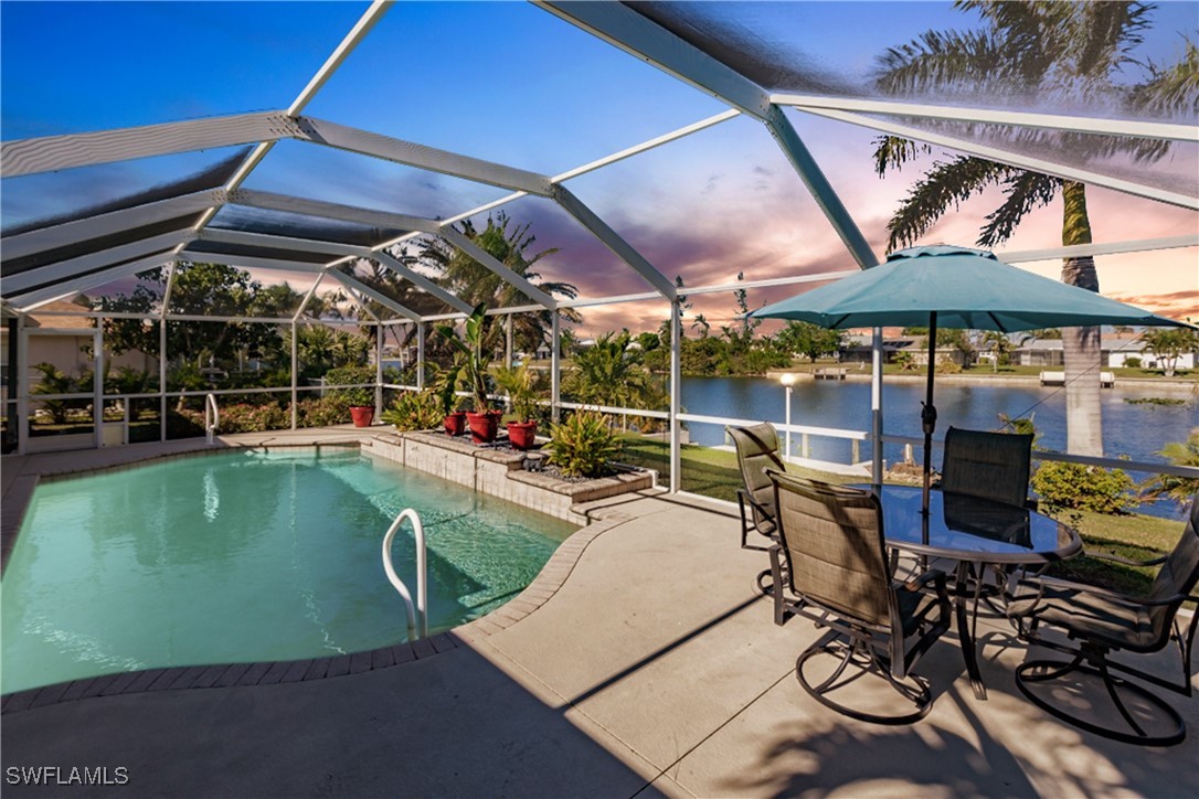 a view of a swimming pool with a patio