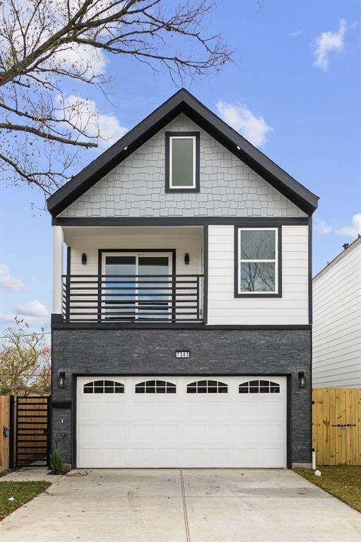 a front view of a house with a garage