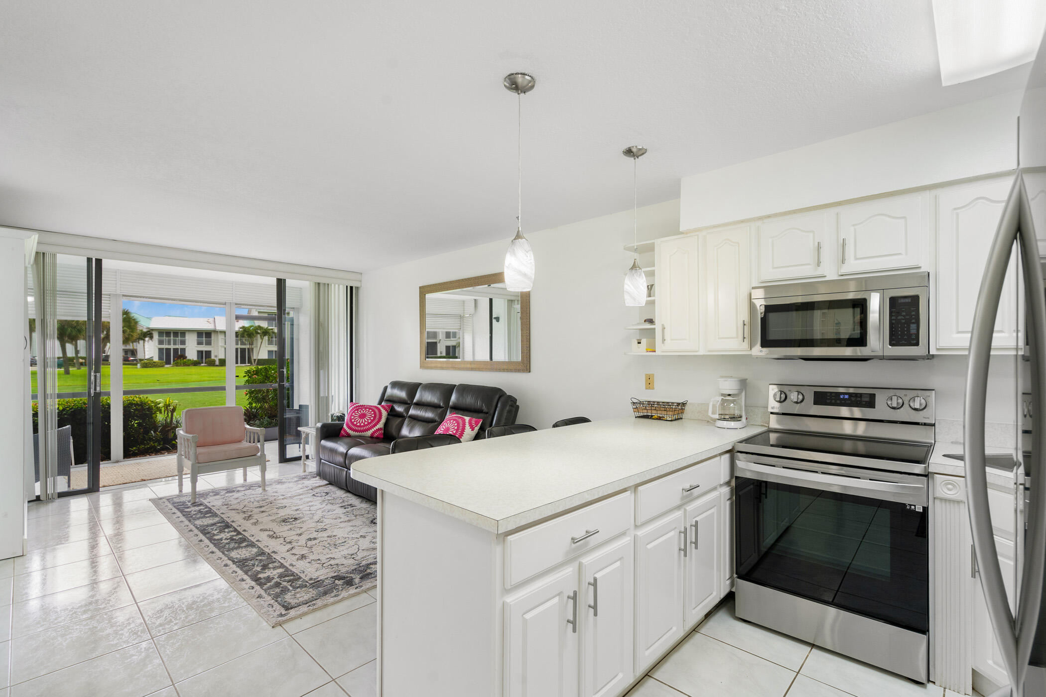 a kitchen that has a stove and a microwave