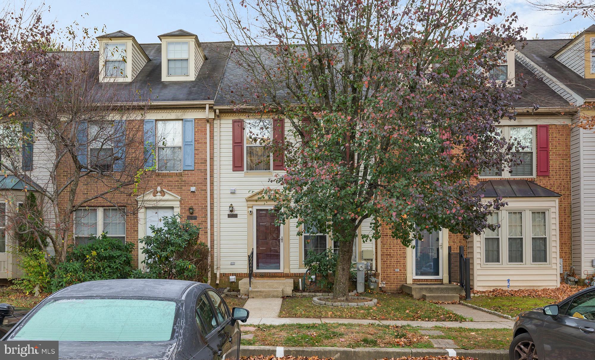 a view of a brick building next to a yard