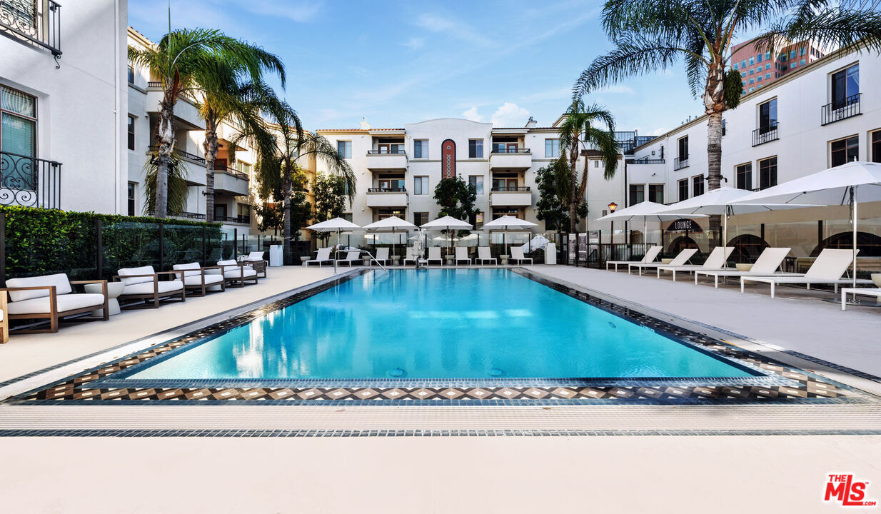 a view of swimming pool with outdoor seating