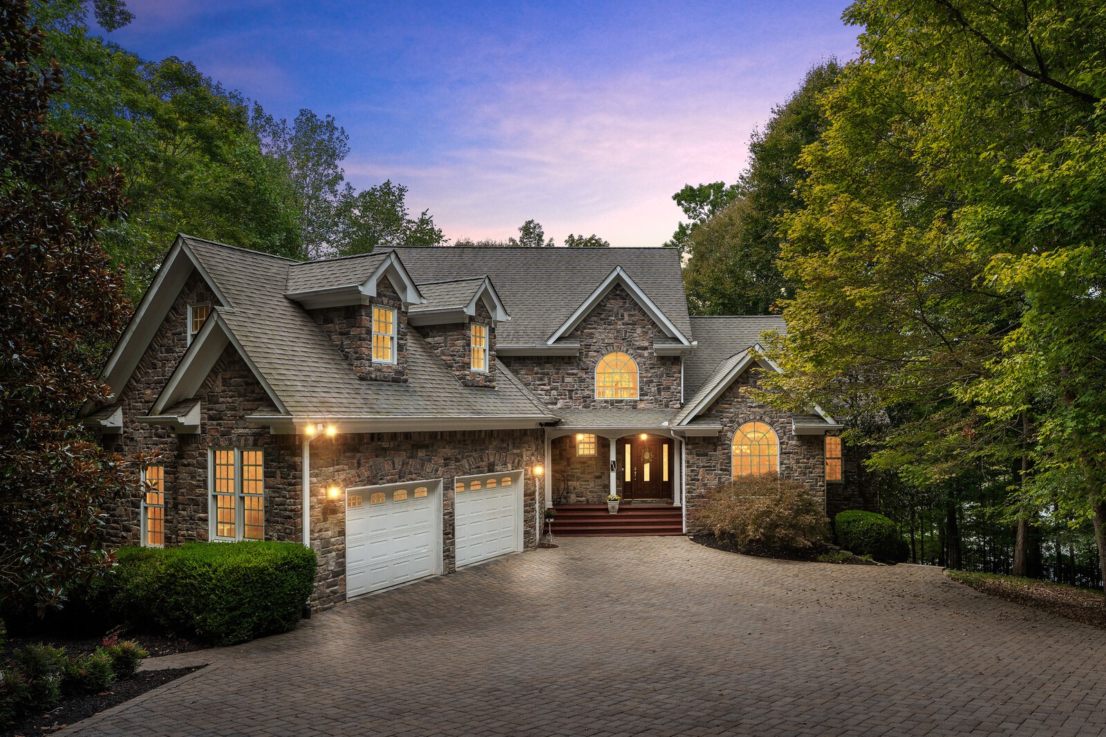 a front view of a house with garden