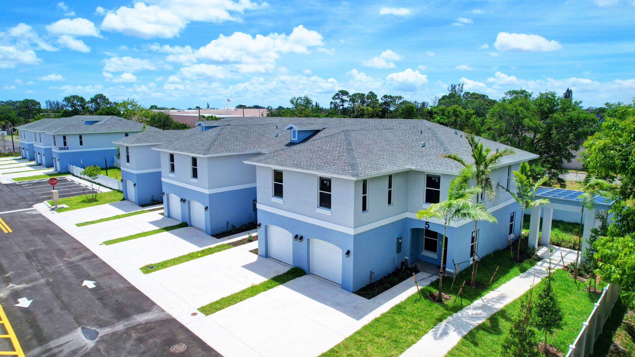 an aerial view of a house with a big yard