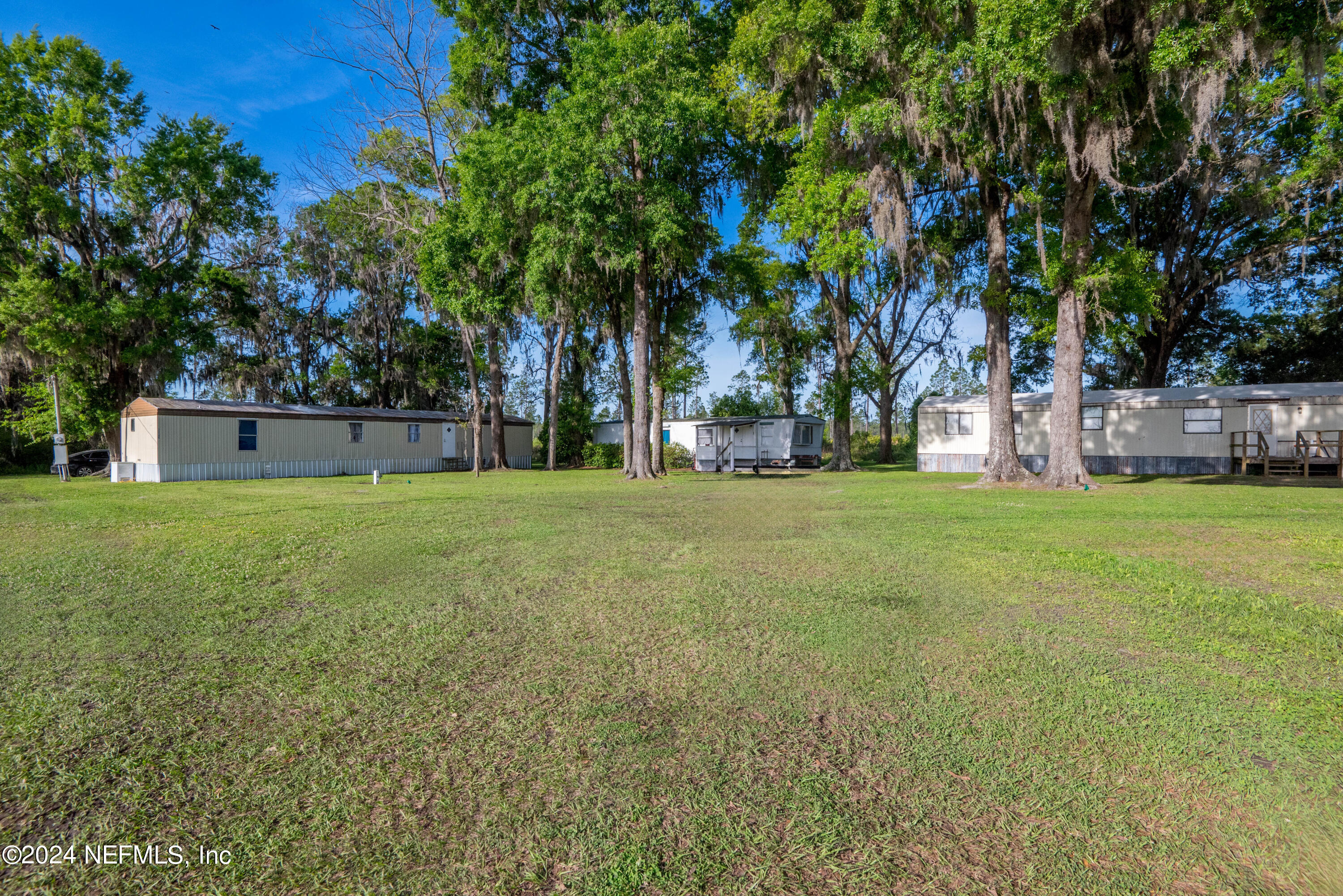 a view of a house with a big yard