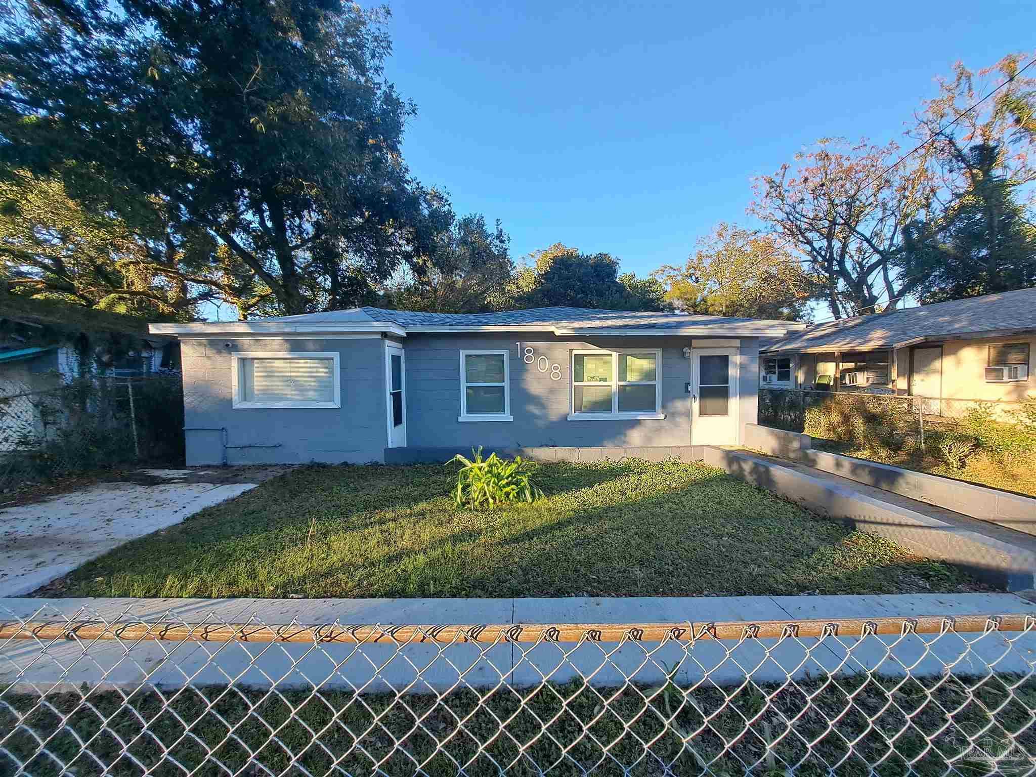 front view of a house with a yard