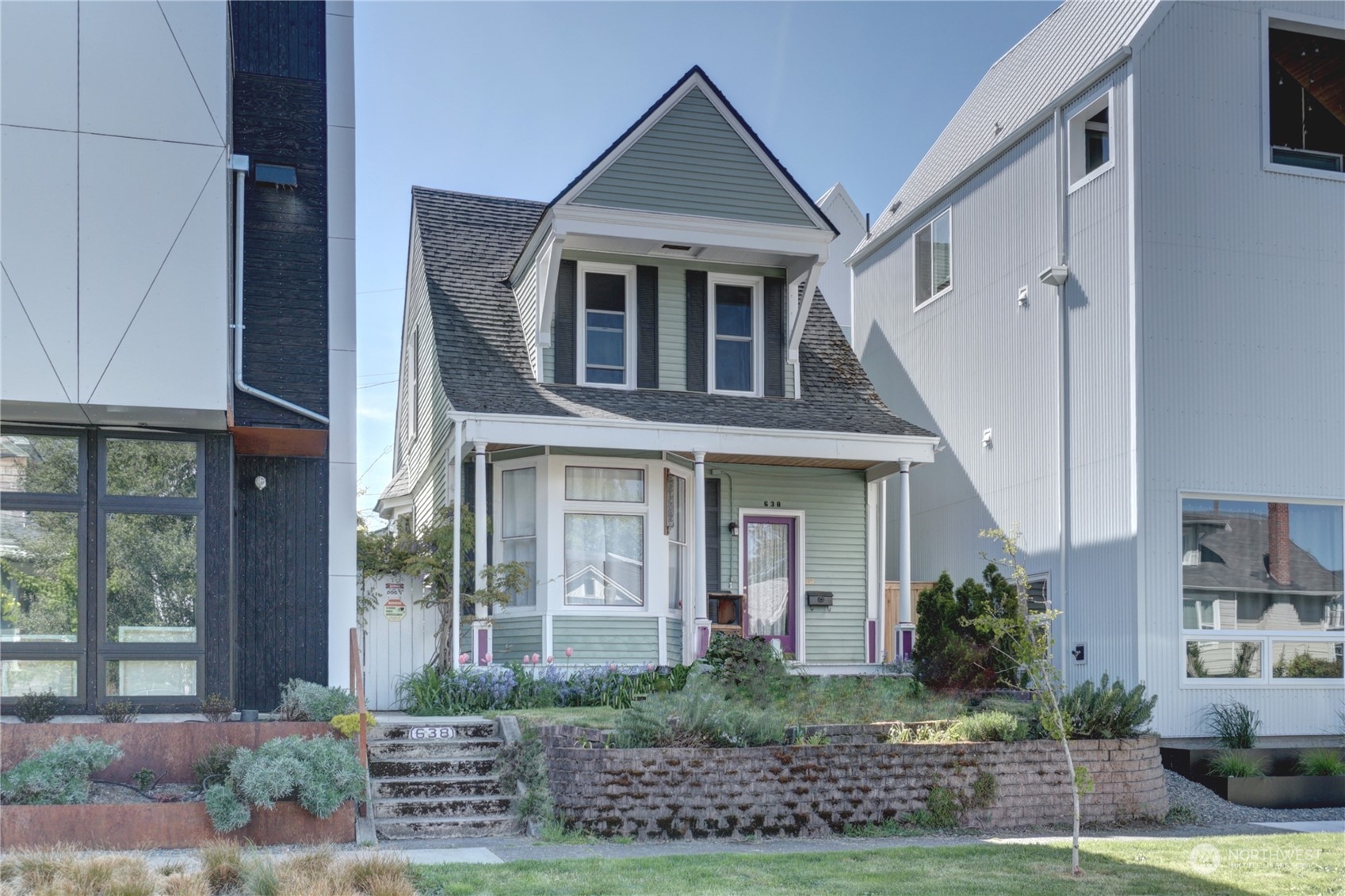 a front view of a house with garden