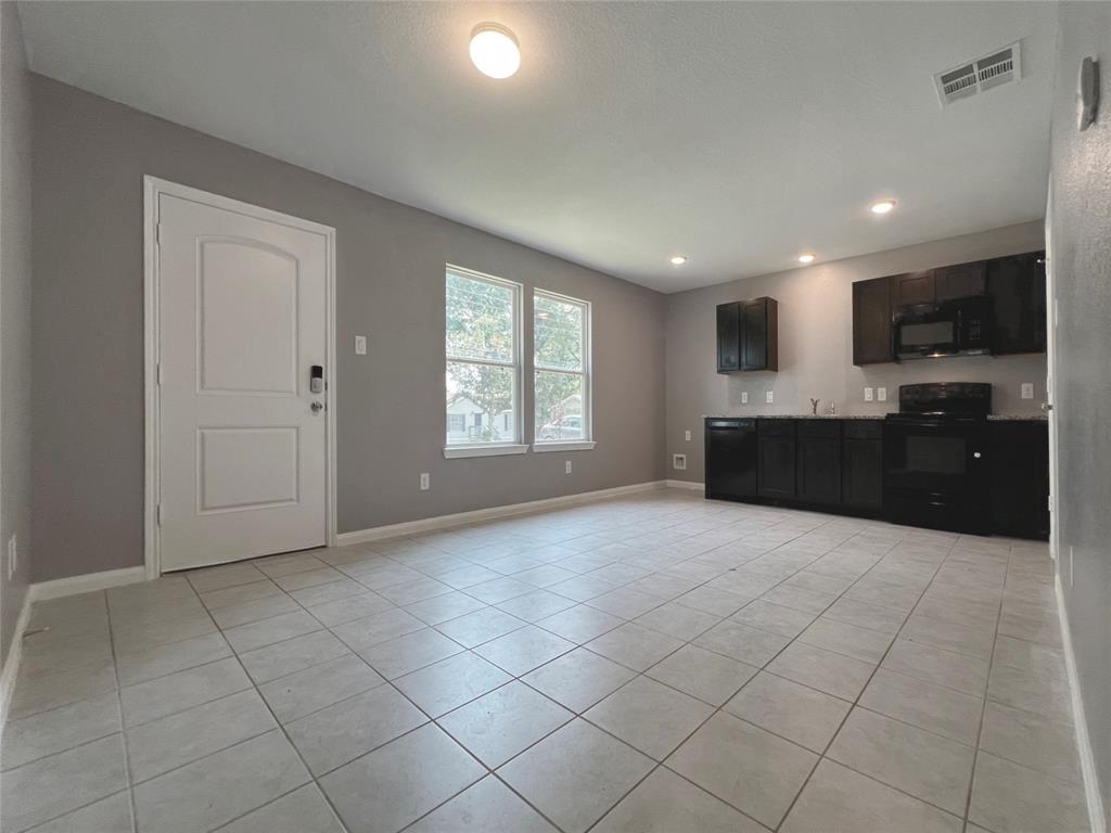 a big room with windows and view kitchen