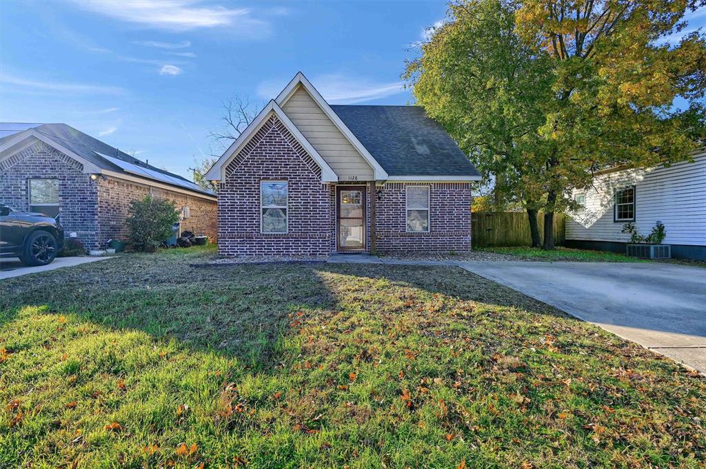 front view of a house with a yard