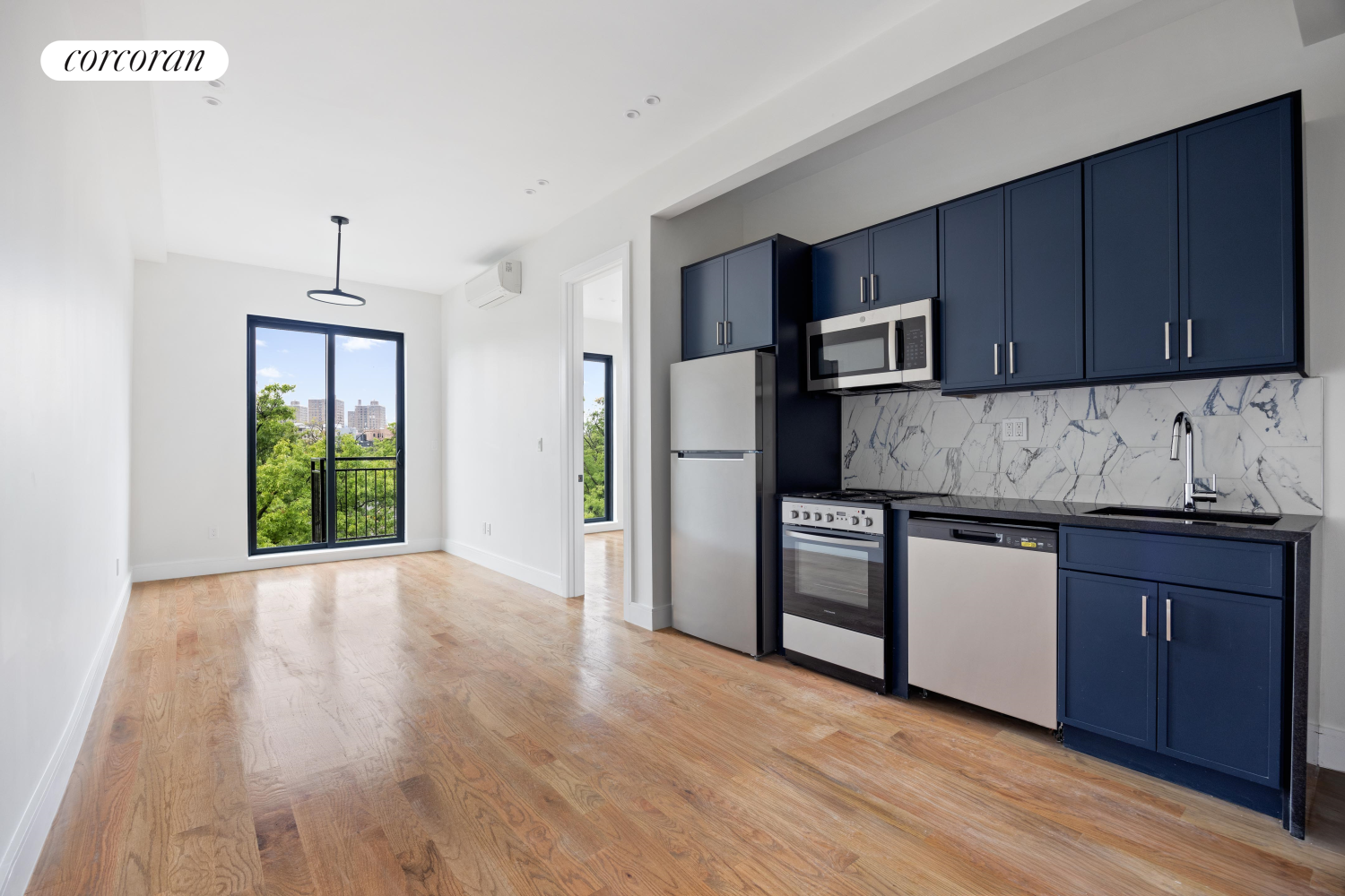 a kitchen with granite countertop wooden floors and stainless steel appliances