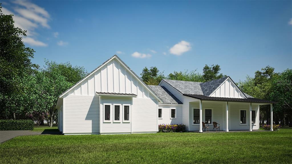 a front view of a house with a garden and yard