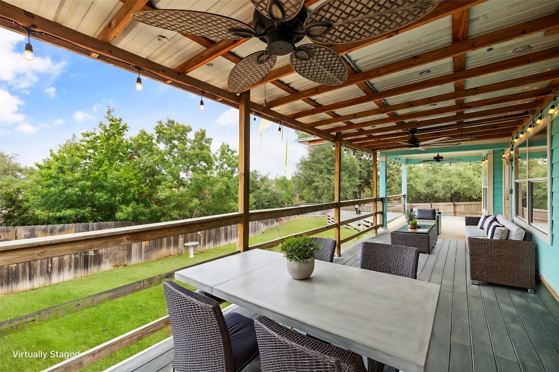 a view of balcony with couch and chairs