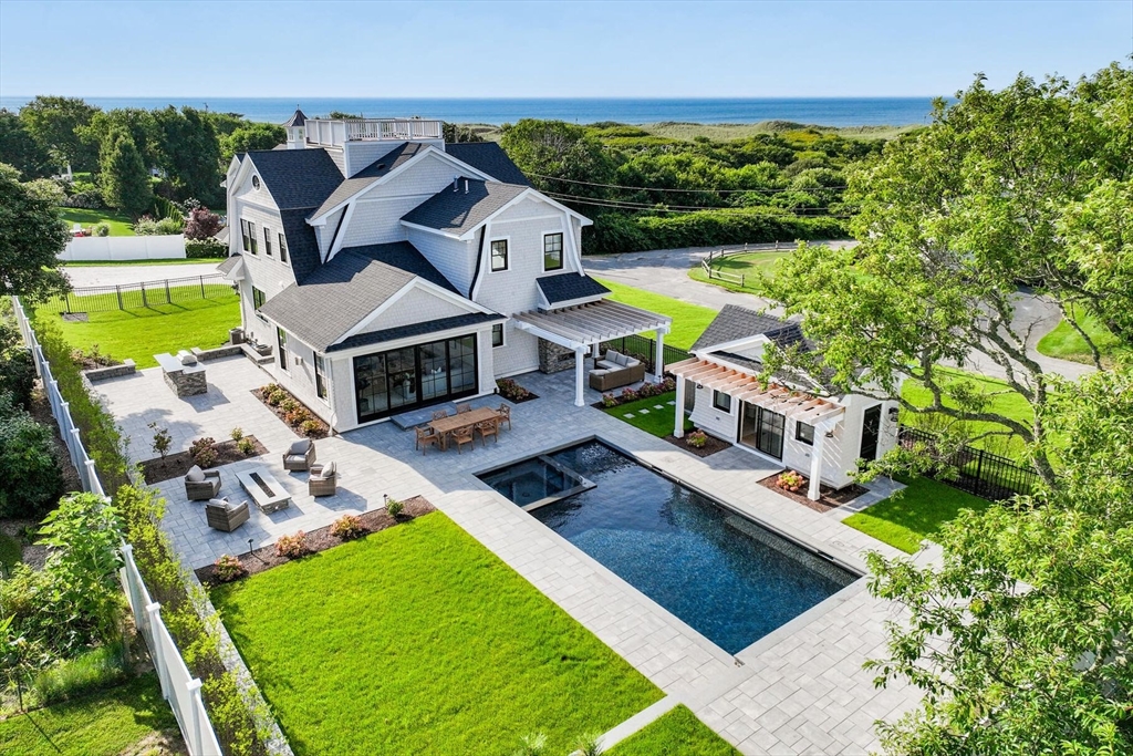 an aerial view of a house with a garden